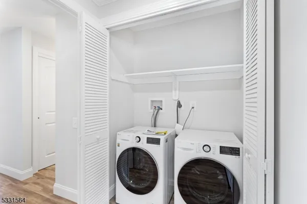 a view of storage and utility room with washer and dryer