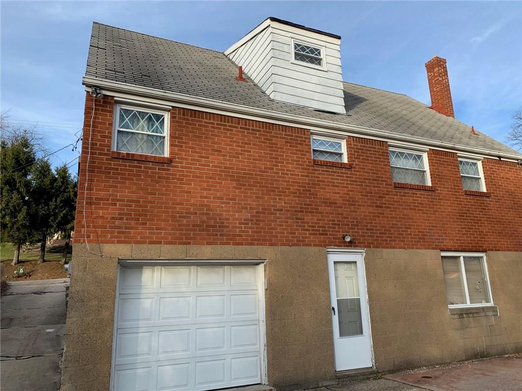 6813 Shannon Road Verona, PA 15147 - Photo 3 of 20 Rear of the home with a newer garage door