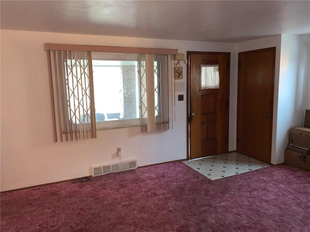 6813 Shannon Road Verona, PA 15147 - Photo 4 of 20 Entry and family room...that carpeting has been protecting hardwood floors for years!