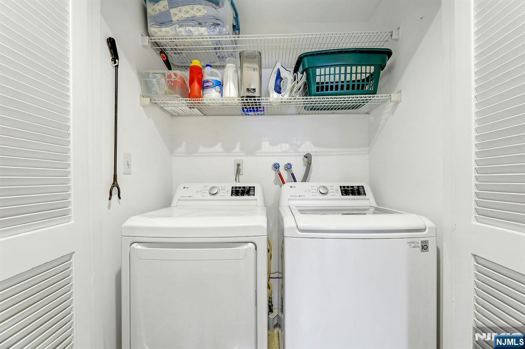1712 Faulkner Court Mahwah, NJ 07430 - Photo 15 of 17 a utility room with dryer and washer