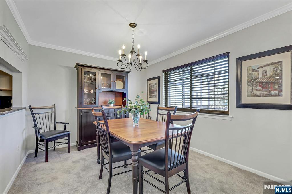 1712 Faulkner Court Mahwah, NJ 07430 - Photo 9 of 17 a view of a dining room with furniture window and wooden floor