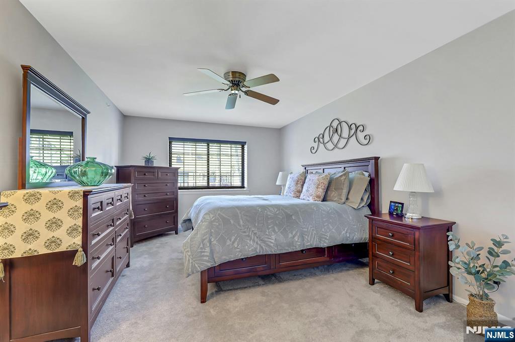 1712 Faulkner Court Mahwah, NJ 07430 - Photo 10 of 17 a bedroom with a bed dresser and a window