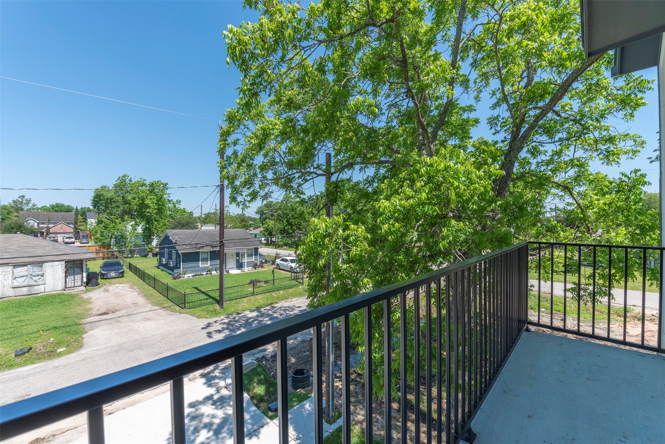 6809 Paris Street Houston, TX 77021 - Photo 26 of 37 Private balcony offering a quiet outdoor escape, perfect for morning coffee or unwinding at the end of the day.