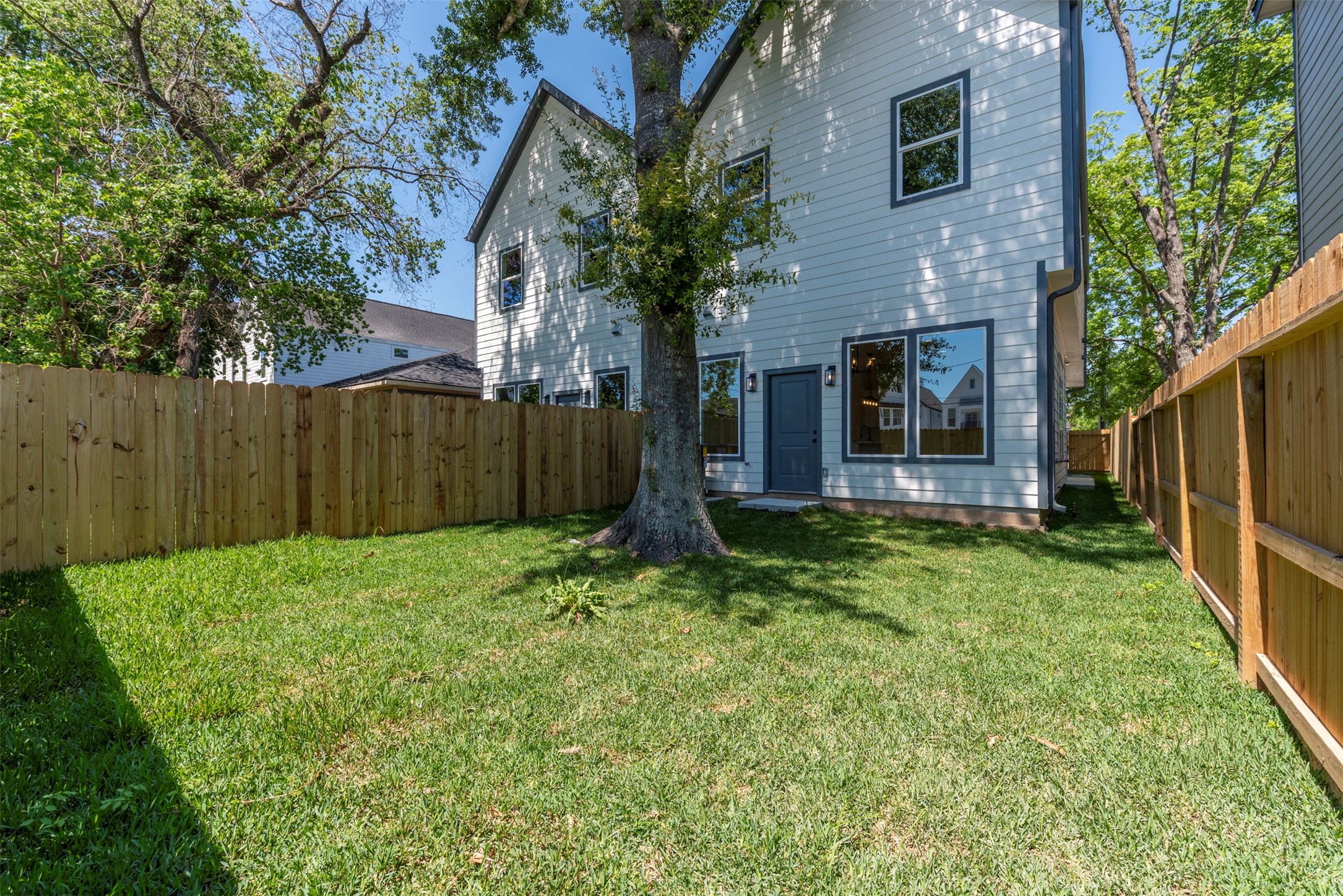 6809 Paris Street Houston, TX 77021 - Photo 31 of 37 Spacious, fully fenced backyard shaded by mature trees, creating a true dog’s paradise with plenty of room to run, play, and relax.