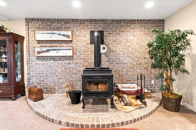 11290 South Southfield Road Mayfield, UT 84643 - Photo 78 of 103 Brick-clad accent wall with an integrated wood-burning stove and a matching brick hearth