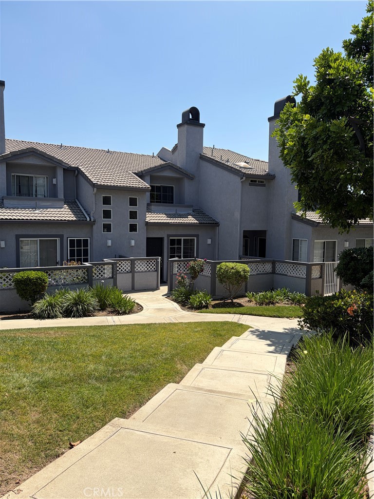 8248 Inglenook Place Rancho Cucamonga, CA 91730 - Photo 11 of 12 a front view of a house with a yard