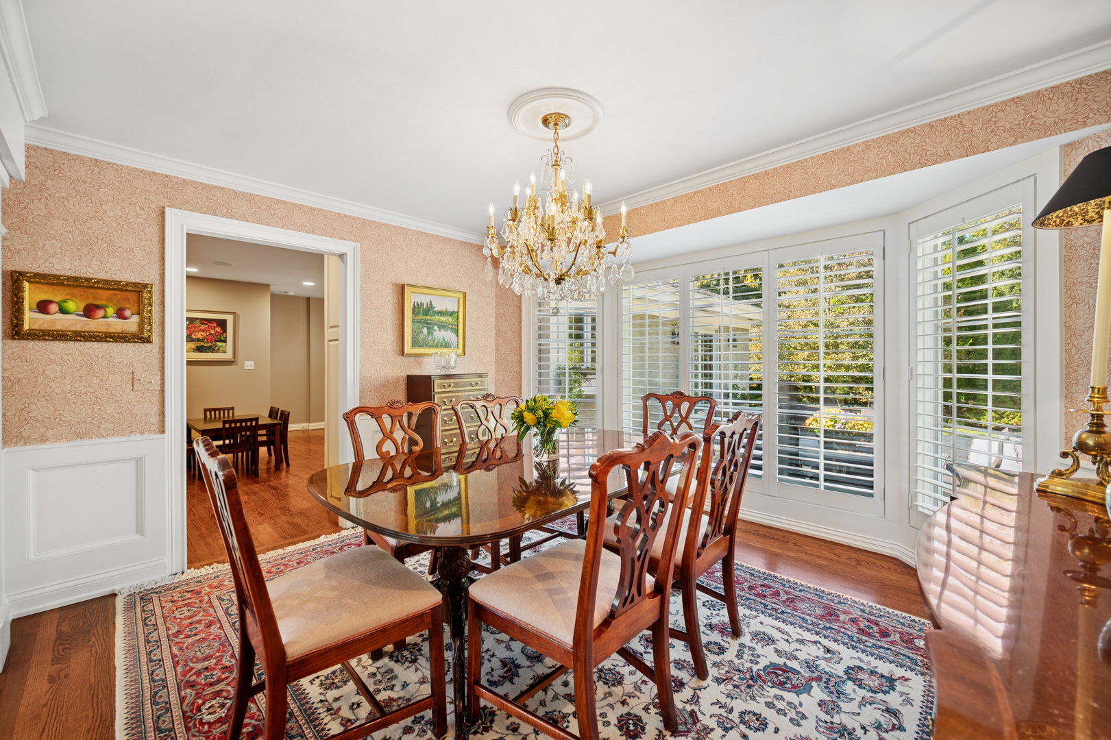 1144 Ranch Road Lake Forest, IL 60045 - Photo 11 of 41 a dining room with furniture a rug and a chandelier