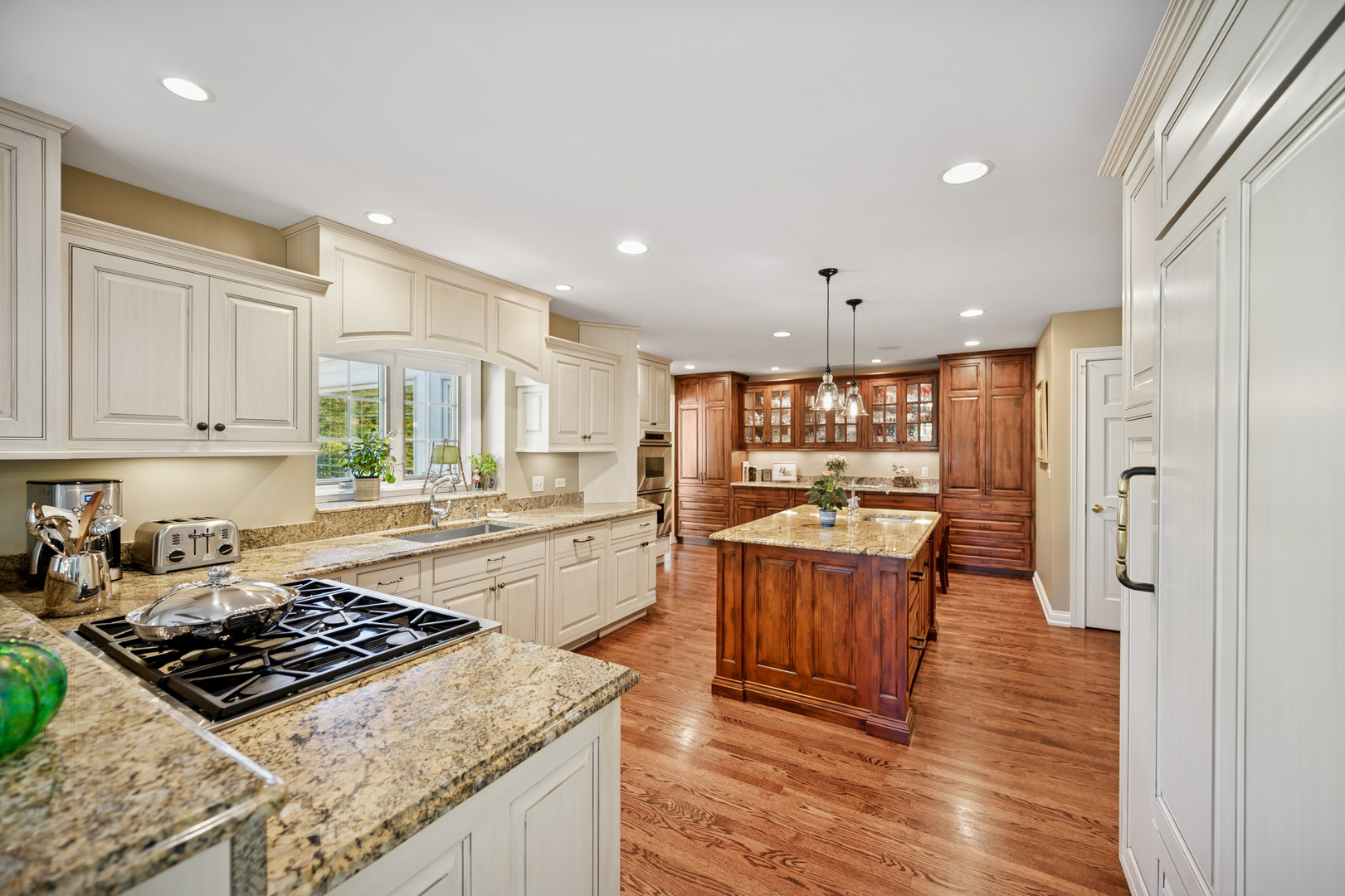 1144 Ranch Road Lake Forest, IL 60045 - Photo 15 of 41 a large kitchen with stainless steel appliances granite countertop a stove and a refrigerator