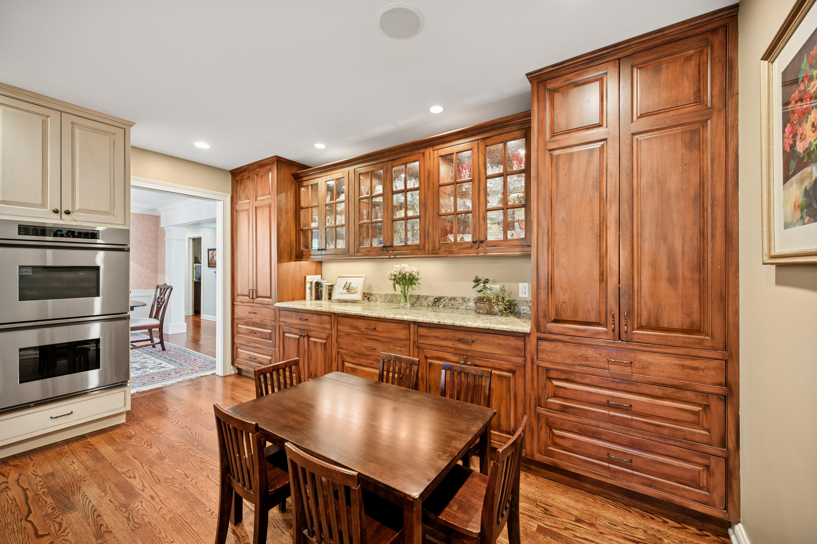 1144 Ranch Road Lake Forest, IL 60045 - Photo 17 of 41 a kitchen with stainless steel appliances granite countertop a stove a refrigerator a kitchen island a table and chairs