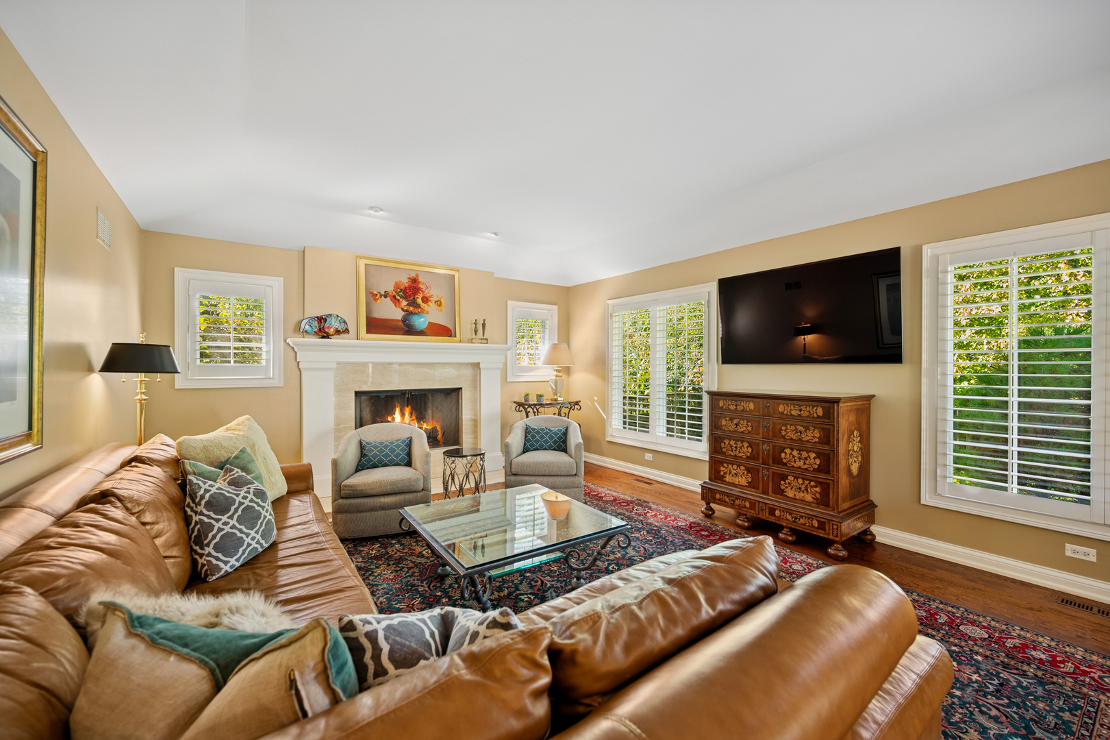 1144 Ranch Road Lake Forest, IL 60045 - Photo 20 of 41 a living room with furniture a flat screen tv and a fireplace