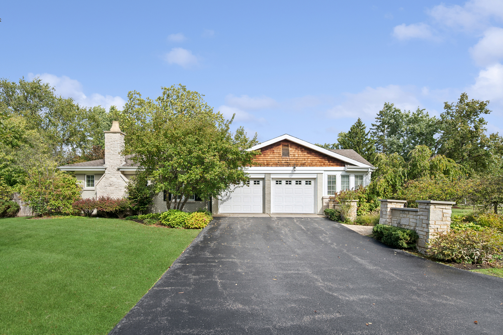 1144 Ranch Road Lake Forest, IL 60045 - Photo 40 of 41 a front view of a house with a yard and trees