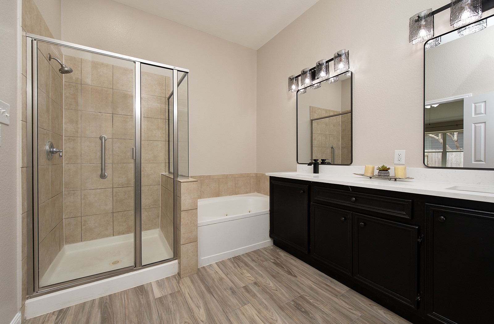 118 Chestnut Court Georgetown, TX 78633 - Photo 16 of 31 a bathroom with a double vanity sink a mirror and a shower