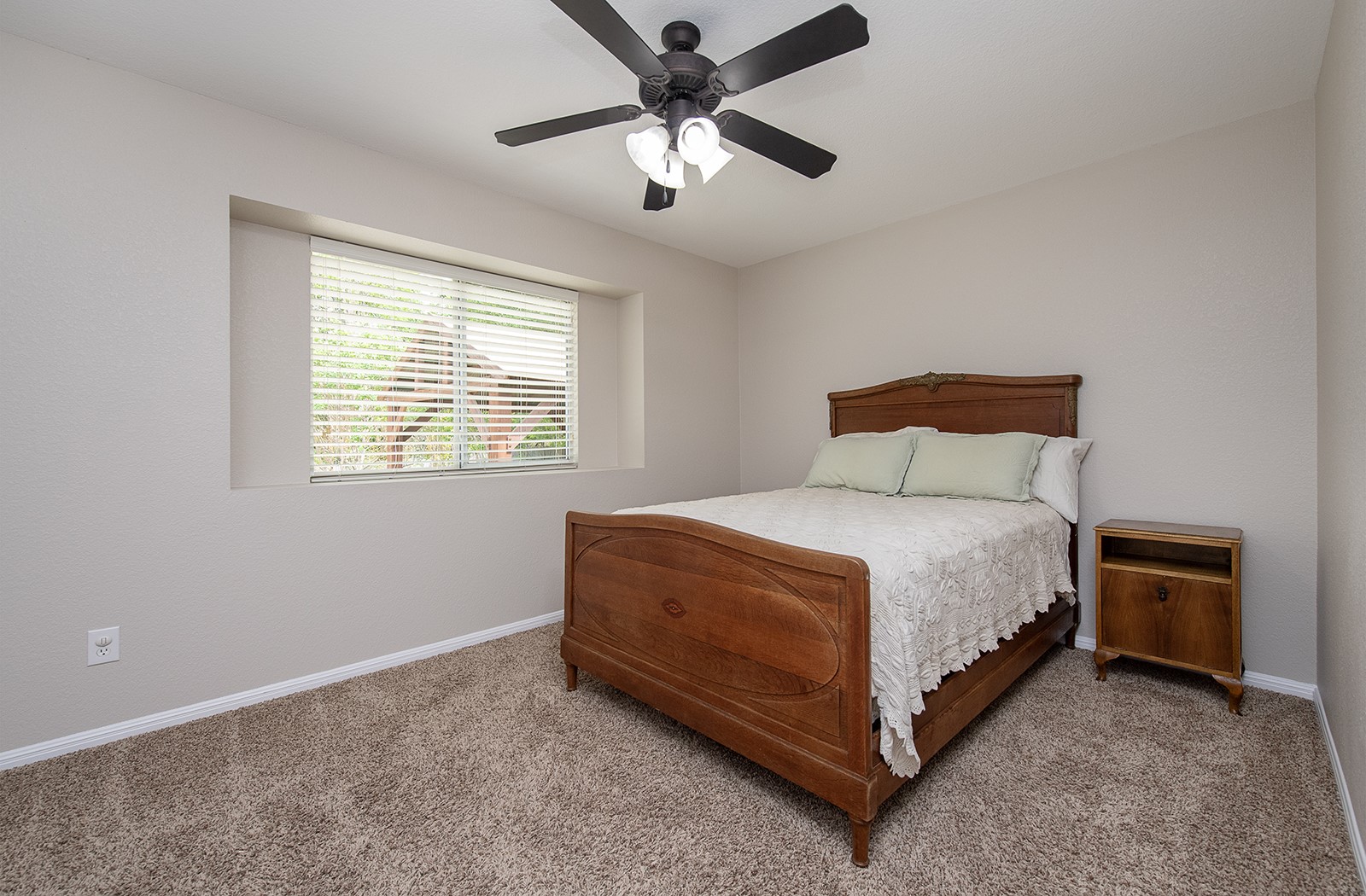118 Chestnut Court Georgetown, TX 78633 - Photo 19 of 31 a spacious bedroom with a bed and a ceiling fan