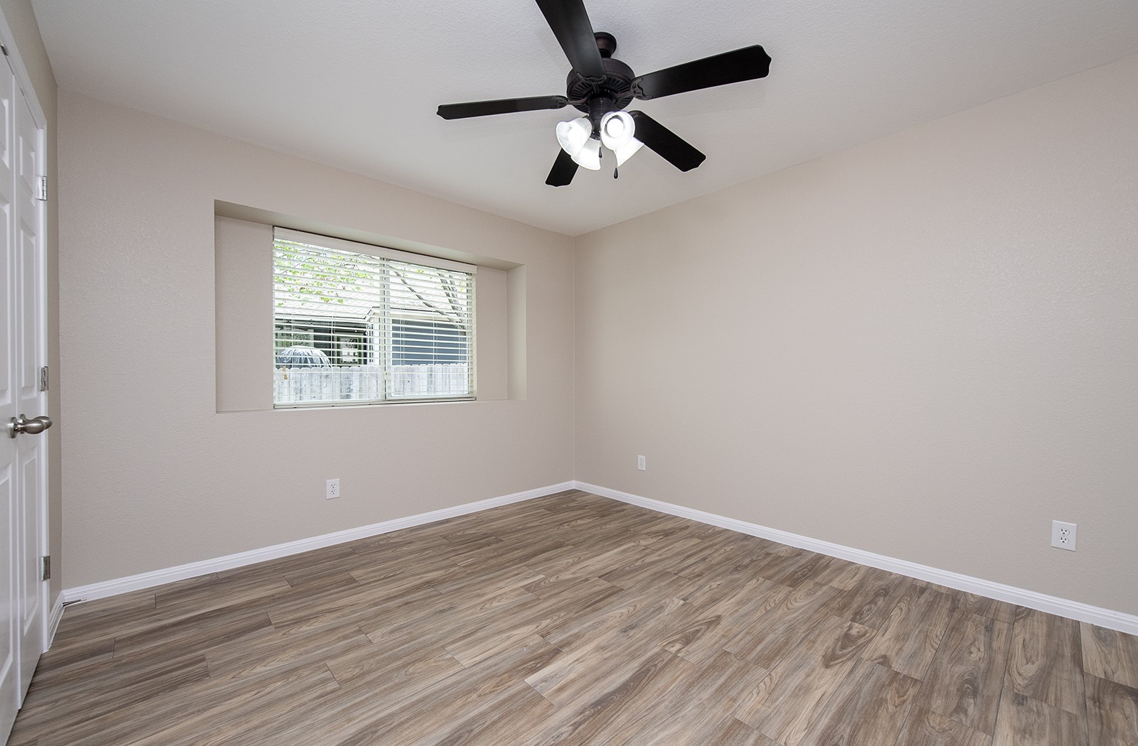 118 Chestnut Court Georgetown, TX 78633 - Photo 22 of 31 an empty room with wooden floor fan and windows
