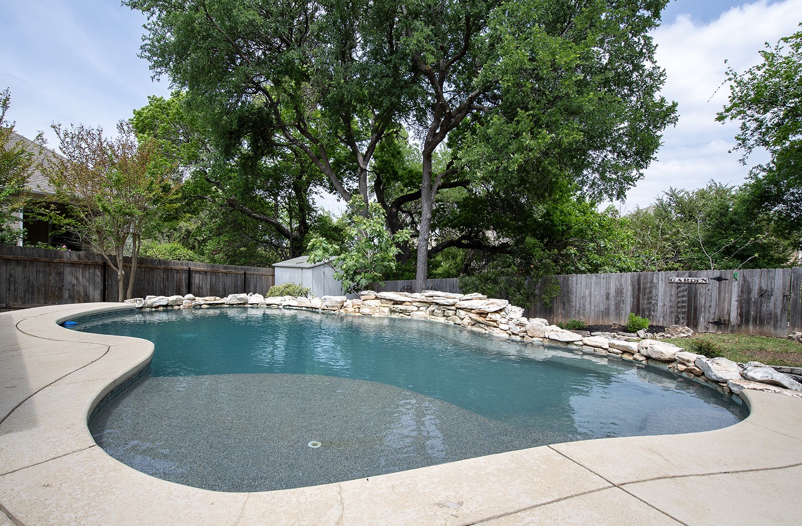 118 Chestnut Court Georgetown, TX 78633 - Photo 3 of 31 a view of a swimming pool with a sitting space