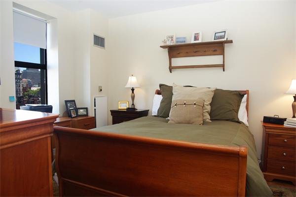 4 Charlesgate East, Unit 602 Boston, MA 02215 - Photo 6 of 10 a bedroom with a bed and a window