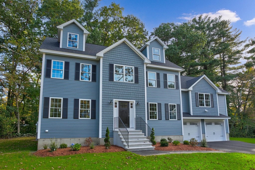 4 Prospector Road Billerica, MA 01821 - Photo 1 of 36 a front view of a house with a yard and garage