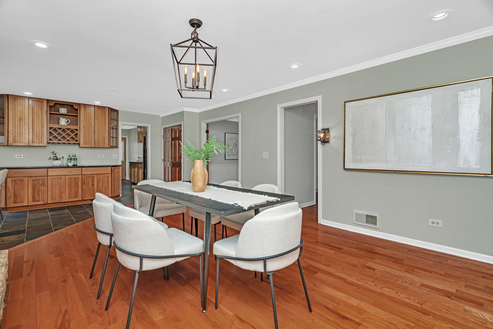 336 Brooklea Court Naperville, IL 60565 - Photo 13 of 39 a view of a dining room with furniture wooden floor and chandelier