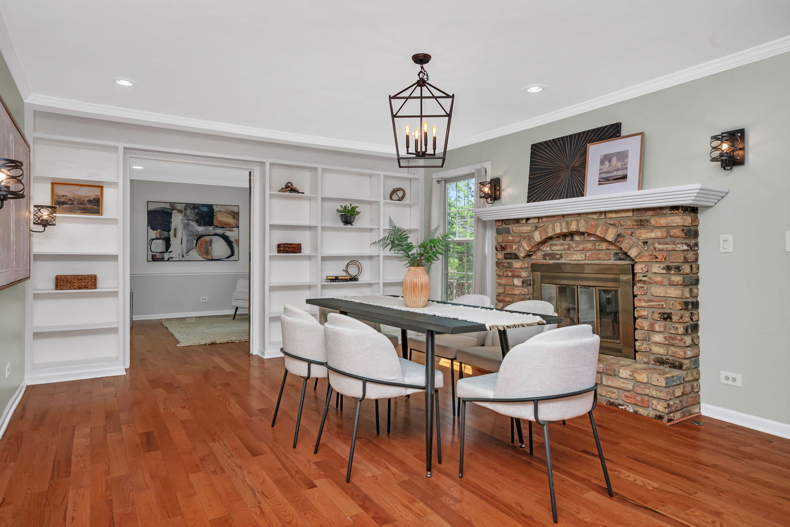 336 Brooklea Court Naperville, IL 60565 - Photo 16 of 39 a view of a dining room with furniture wooden floor and a chandelier