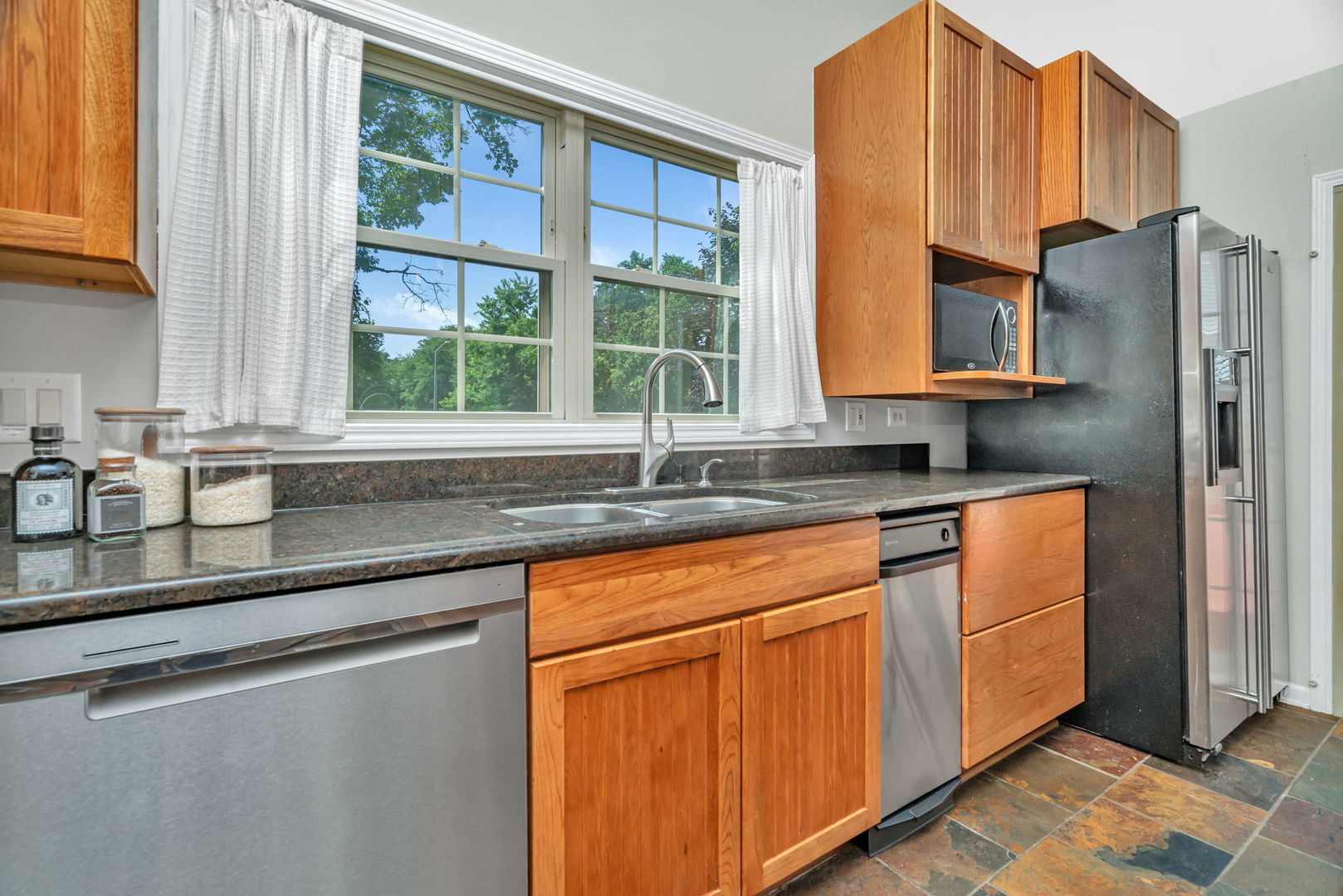 336 Brooklea Court Naperville, IL 60565 - Photo 22 of 39 a kitchen with stainless steel appliances granite countertop a refrigerator and a sink