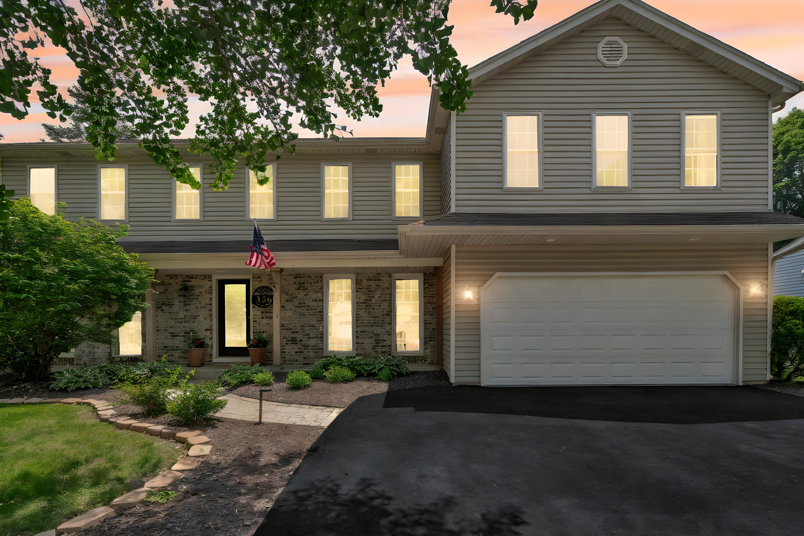 336 Brooklea Court Naperville, IL 60565 - Photo 3 of 39 a front view of a house with a yard and garage