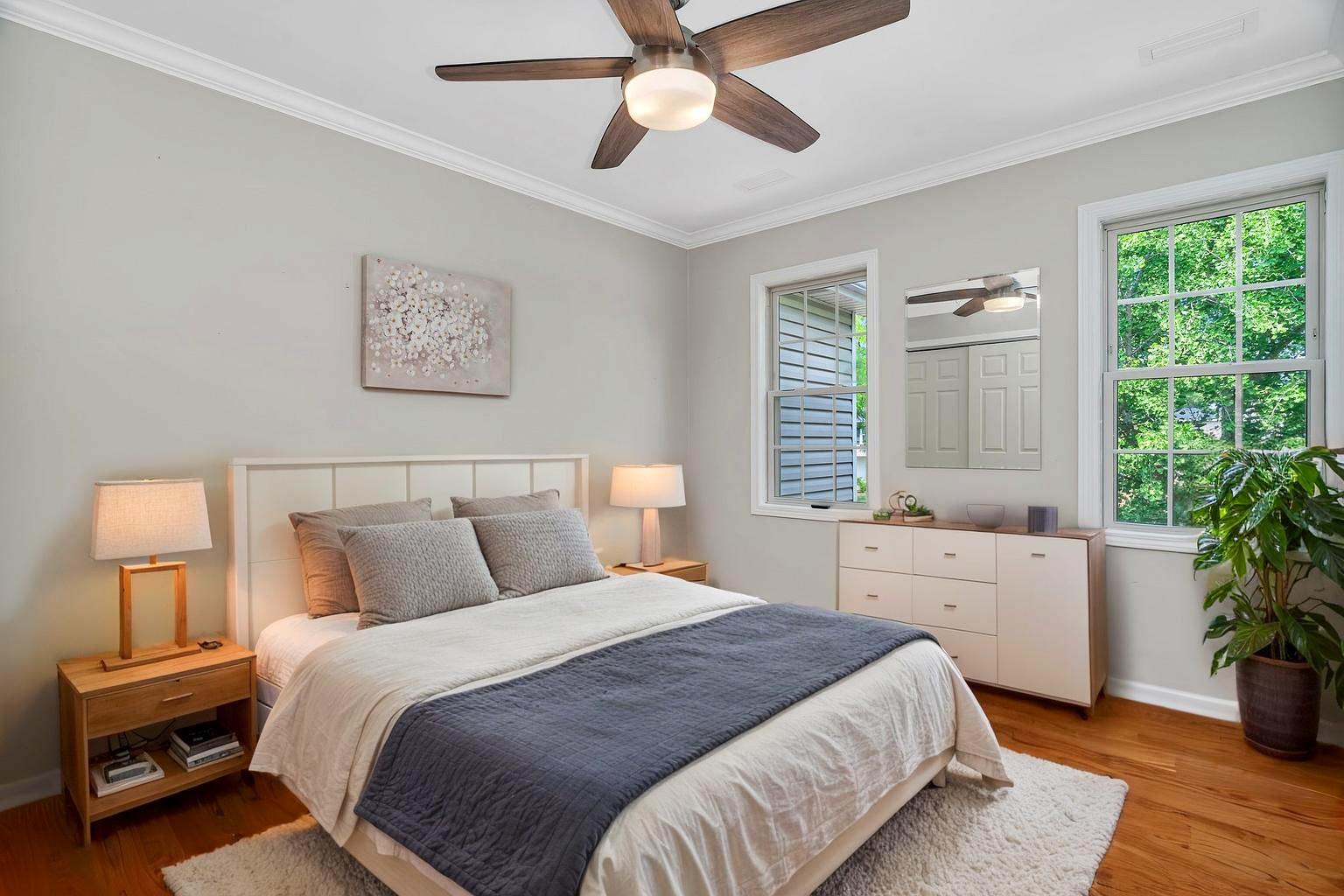 336 Brooklea Court Naperville, IL 60565 - Photo 34 of 39 a bedroom with a large bed and a potted plant