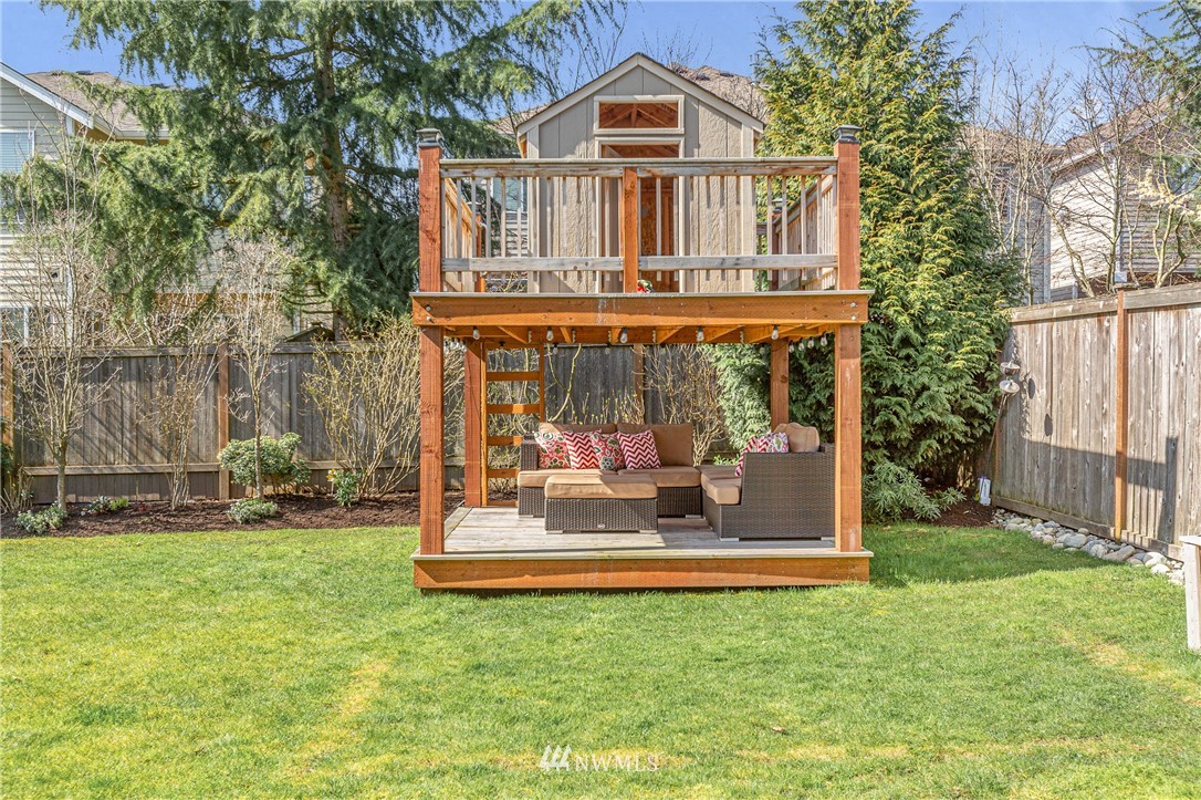 21222 38th Avenue Southeast Bothell, WA 98021 - Photo 22 of 23 a front view of a house with a yard