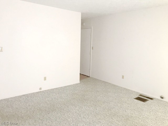 2276 Raber Road, Unit A Uniontown, OH 44685 - Photo 3 of 24 LIV RM VIEW #2 - DOOR LEADS TO GARAGE - HALL TO KITCHEN