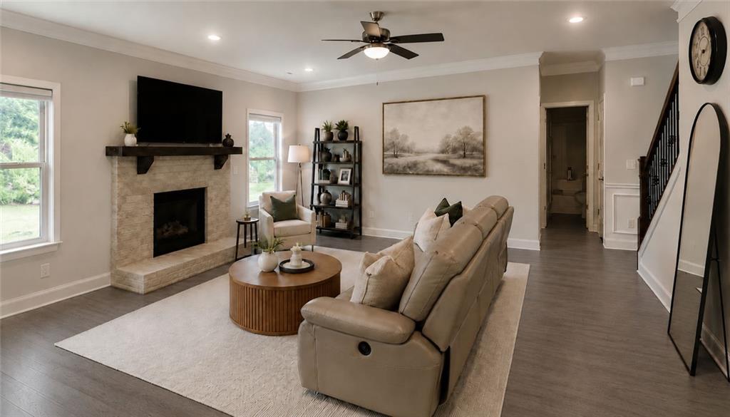 3359 Elkhorn Ridge Run Dacula, GA 30019 - Photo 11 of 35 a living room with furniture a flat screen tv and a fireplace