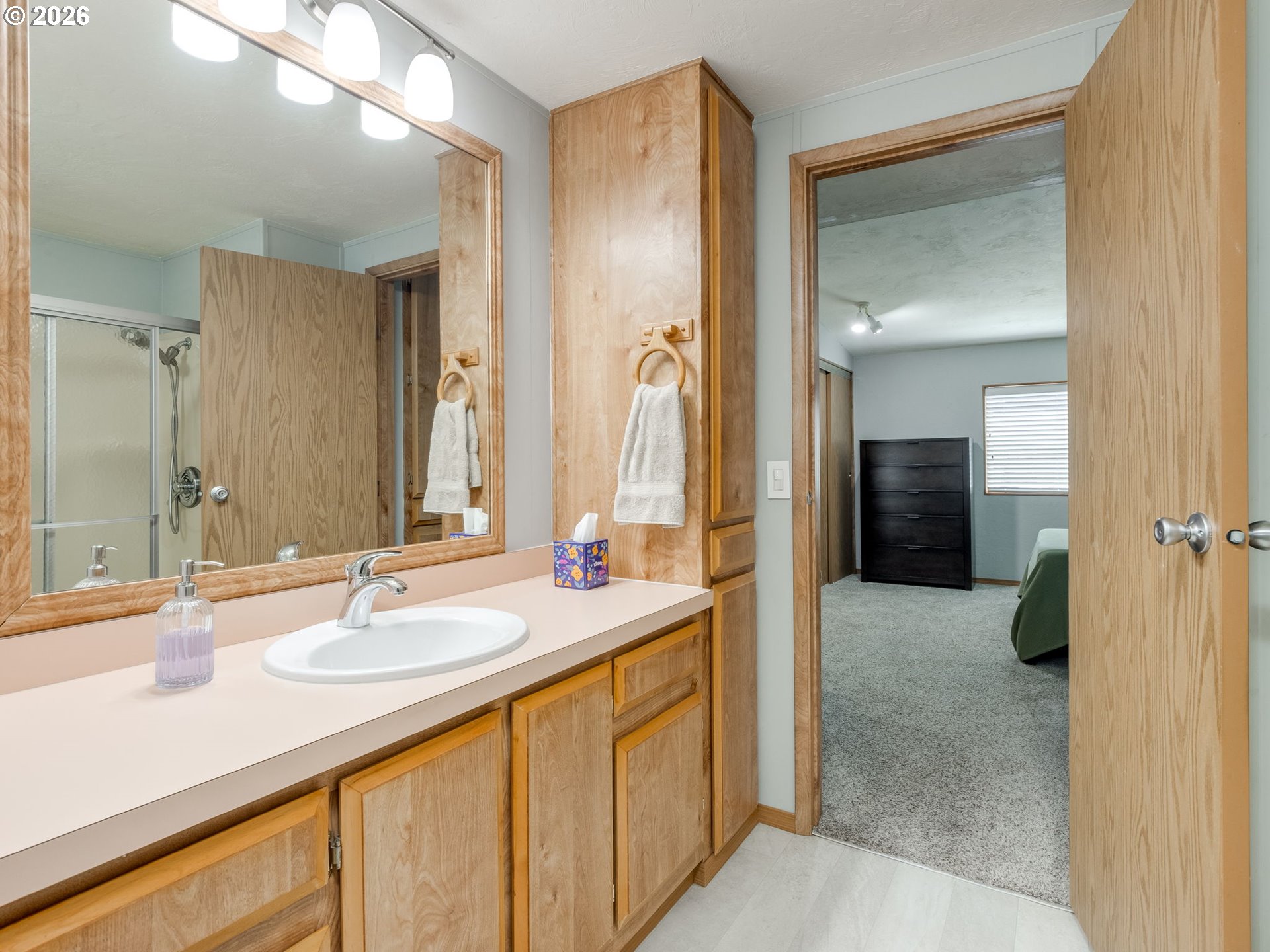 4730 Auburn Road Northeast, Unit 125 Salem, OR 97301 - Photo 25 of 36 a bathroom with a sink and a mirror