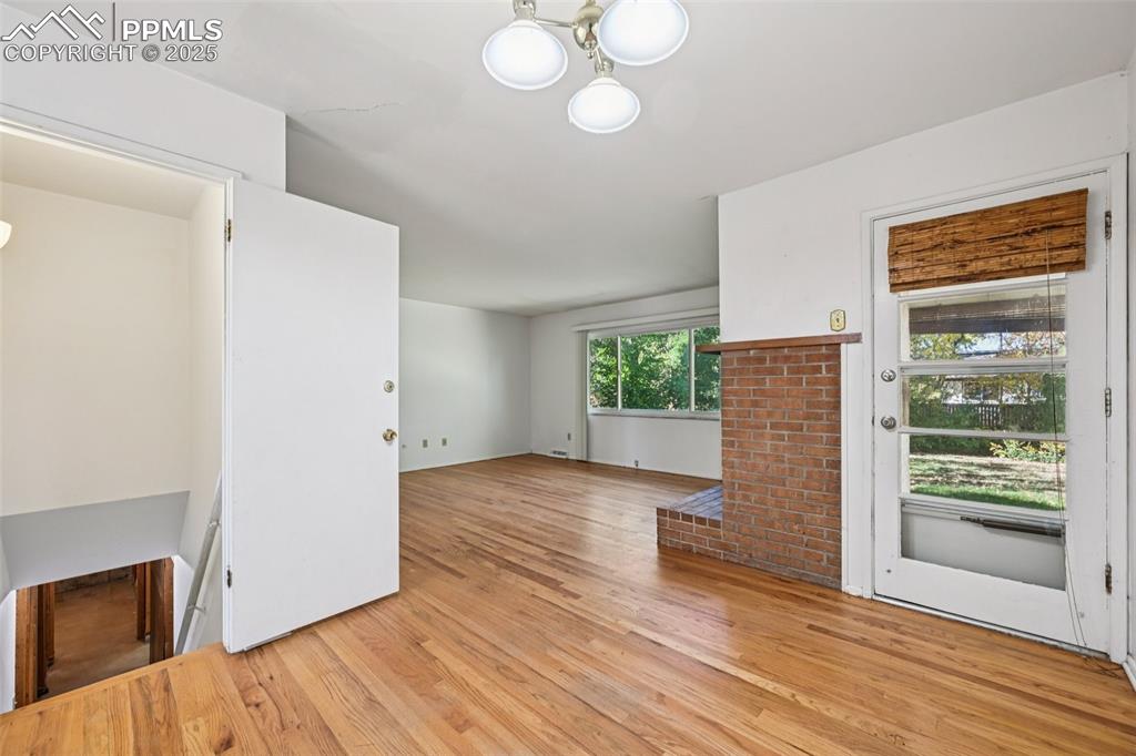 2977 South Oneida Street Denver, CO 80224 - Photo 15 of 50 a view of empty room with wooden floor and fan