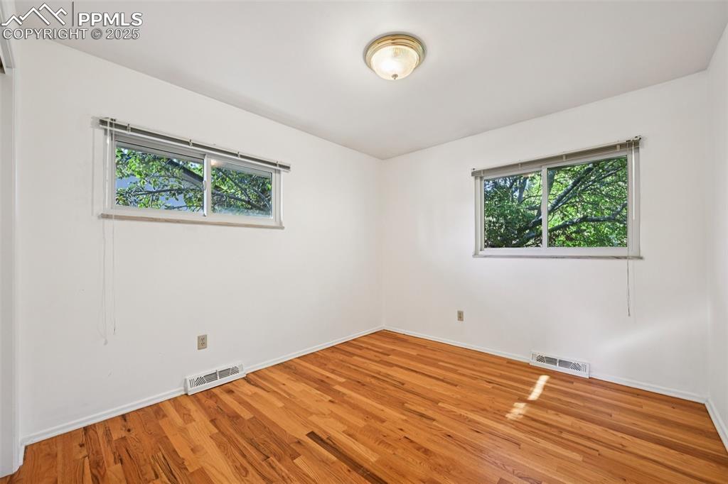 2977 South Oneida Street Denver, CO 80224 - Photo 29 of 50 a view of a room with wooden floor and window