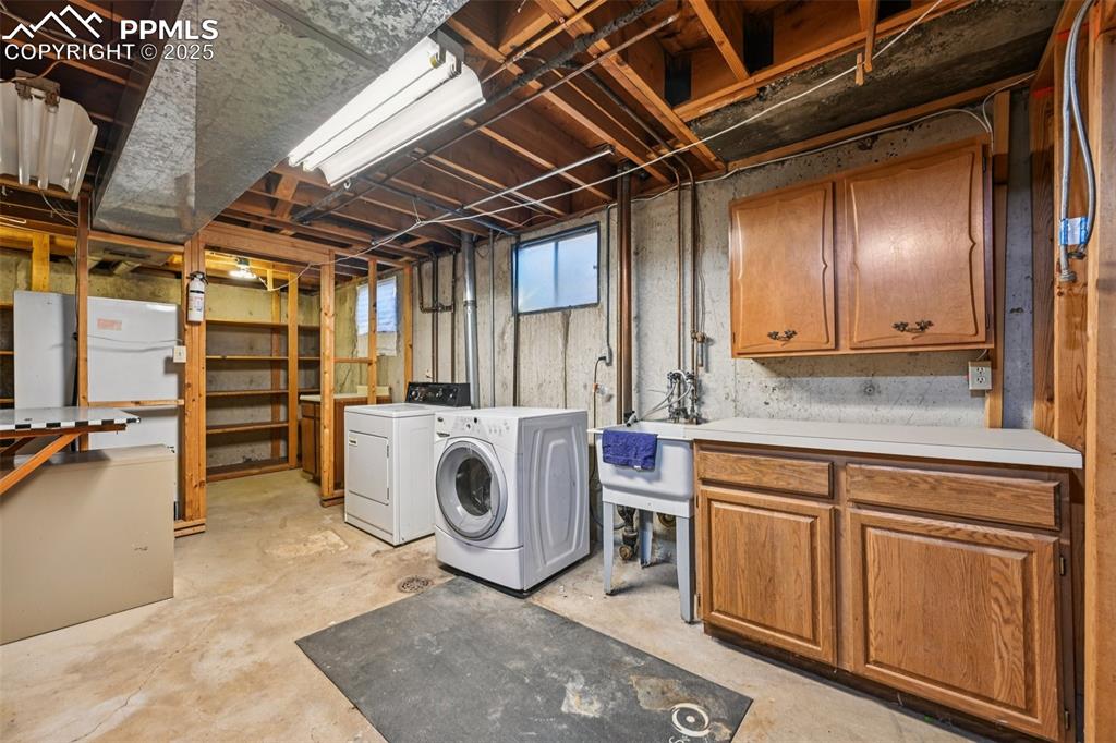 2977 South Oneida Street Denver, CO 80224 - Photo 38 of 50 a utility room with dryer and washer