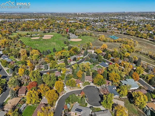 an aerial view of a residential houses with outdoor space