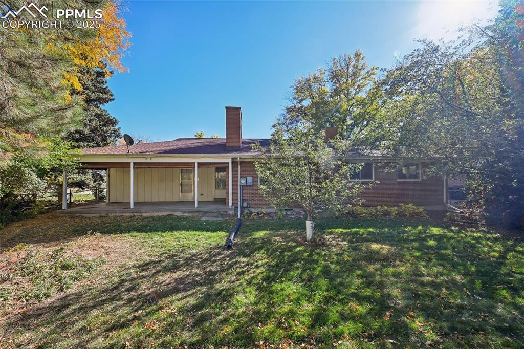 2977 South Oneida Street Denver, CO 80224 - Photo 6 of 50 front view of a house with a yard
