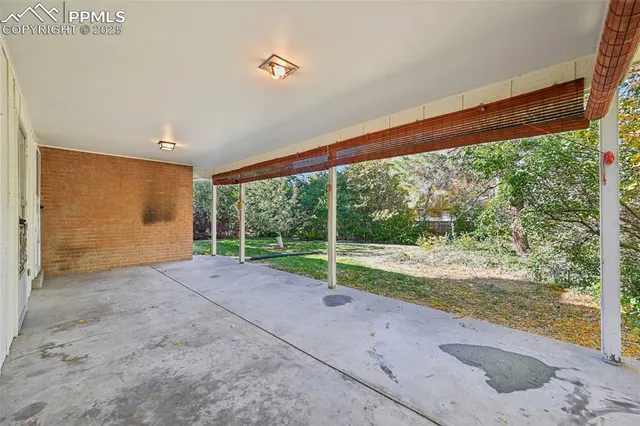 a view of a room with porch and a yard