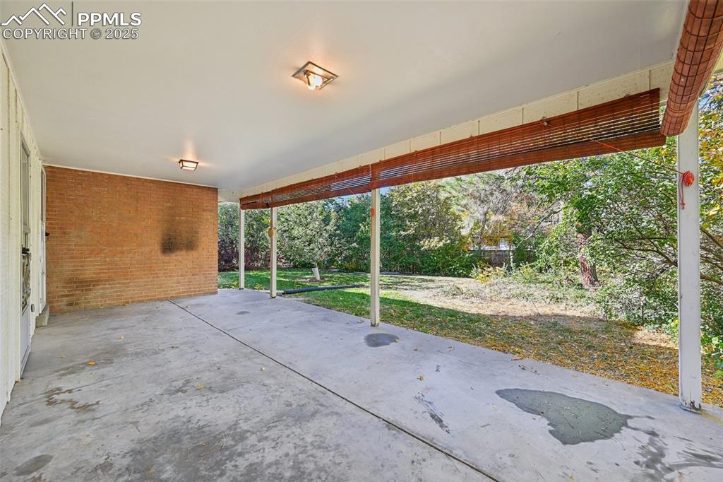 2977 South Oneida Street Denver, CO 80224 - Photo 8 of 50 a view of a room with porch and a yard