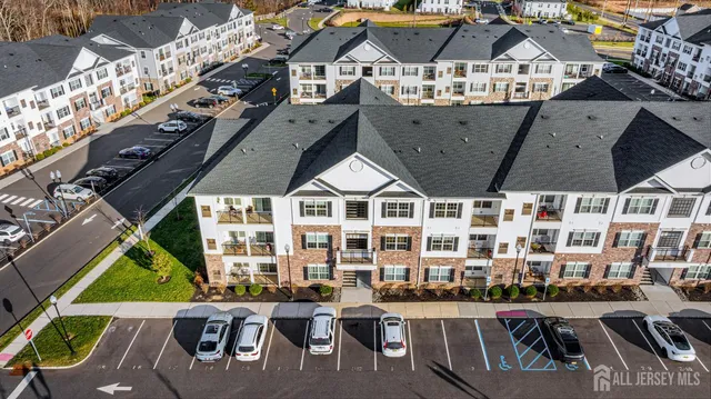 a view of swimming pool with a chairs and table in the balcony