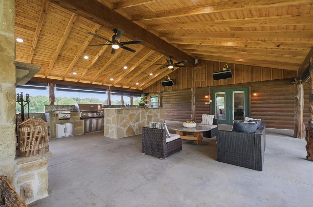 465 Emberson Ranch Road Pilot Point, TX 76258 - Photo 26 of 40 a building outdoor space with patio furniture and potted plants
