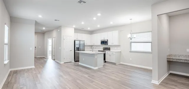 a view of kitchen with wooden floor