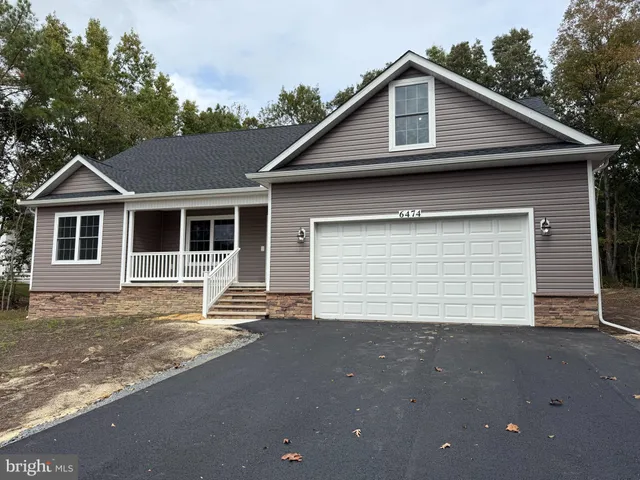 a front view of a house with a garage