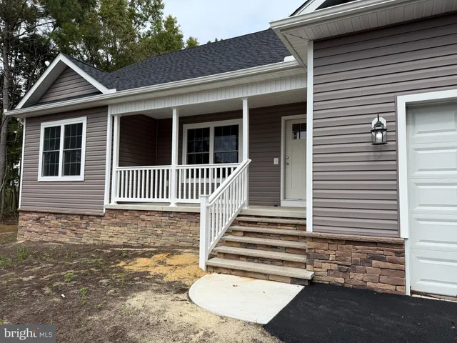 a front view of a house with a porch