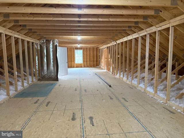 a view of balcony with wooden floor and fence