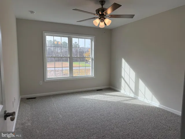 a bathroom with a granite countertop sink toilet and bathtub