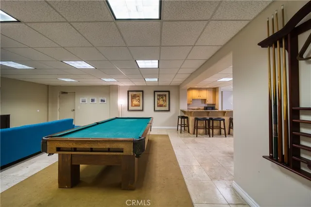 a room with furniture pool table table tennis pool table and windows