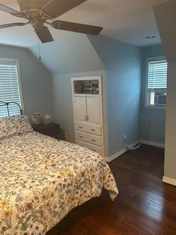 a bathroom with a shower toilet and sink