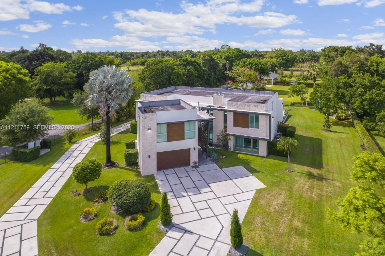14305 Stirling Road Southwest Ranches, FL 33330 - Photo 59 of 66 a aerial view of a house with a big yard
