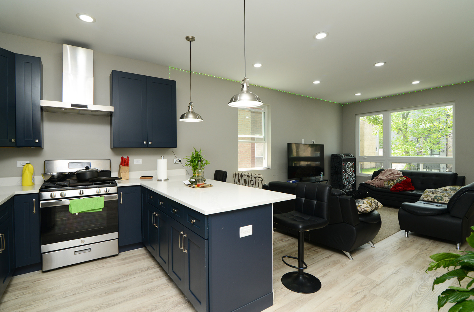 1051 North Springfield Avenue Chicago, IL 60651 - Photo 22 of 50 a kitchen with stainless steel appliances granite countertop a sink a stove and a refrigerator
