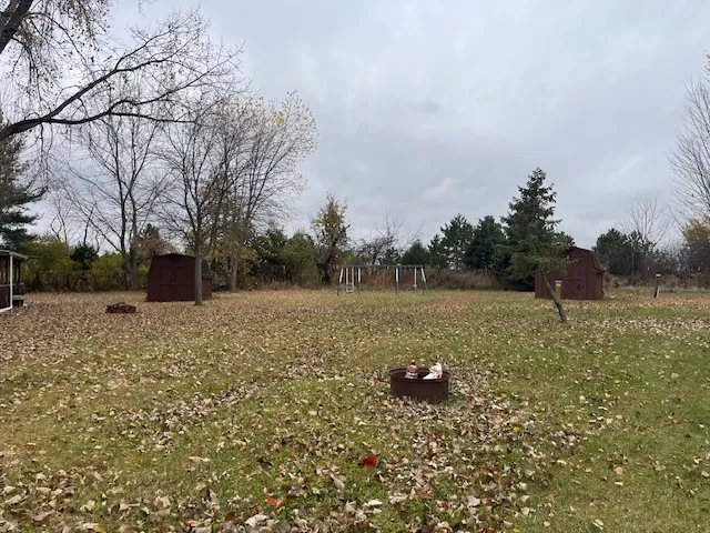 a backyard of a house with lots of green space
