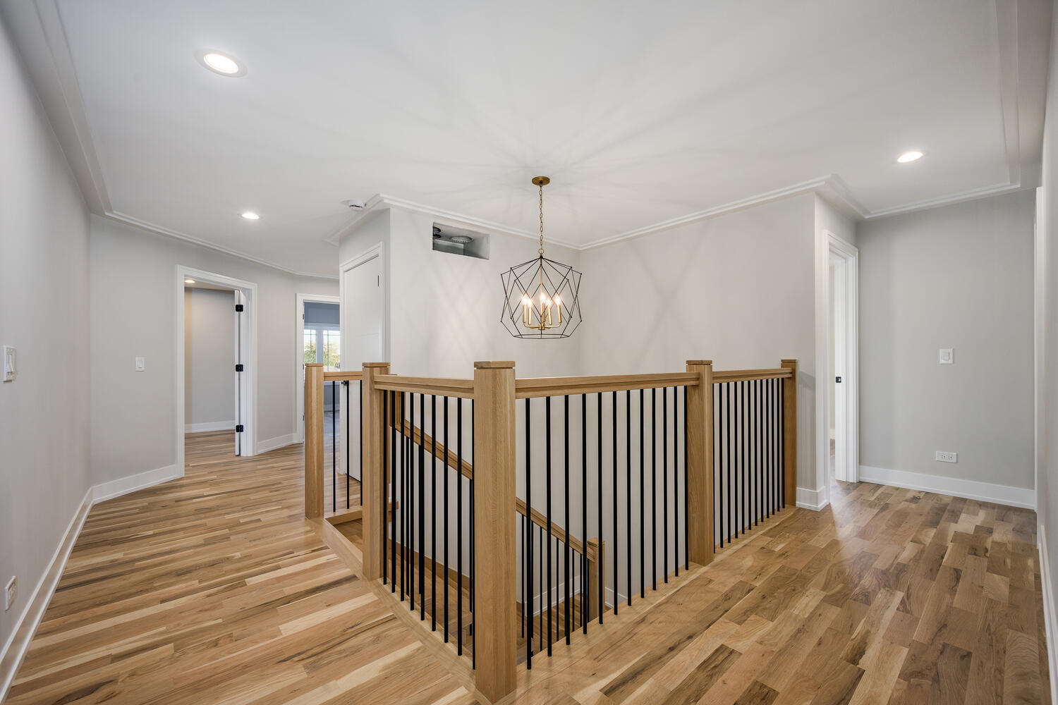 22642 Frontier Court Frankfort, IL 60423 - Photo 18 of 29 a view of a hallway with wooden floor and staircase
